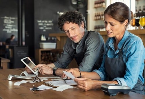 couple reviewing financial budget documents