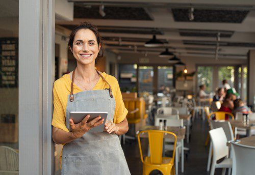 Small business owner with ipad in hand