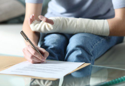 injured person filling out a form for income protection