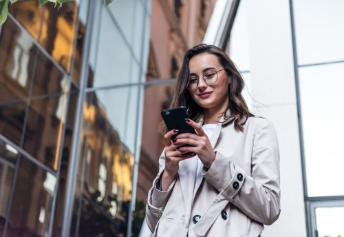 Business women with cellphone in hand