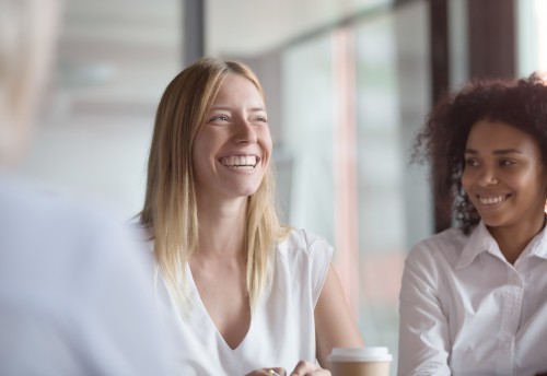 two business women smiling