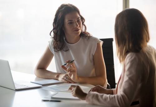 two women at a desk