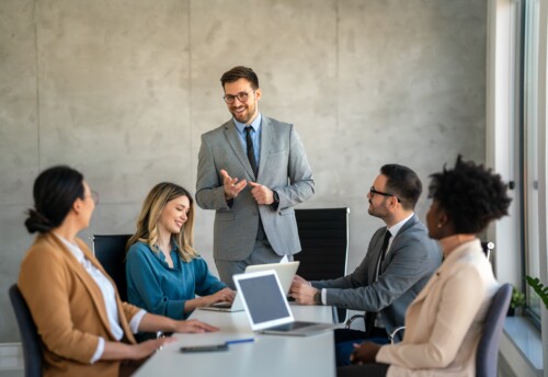 Successful,Multiethnic,Business,People,Presenting,Analytical,Report,While,Working,Together