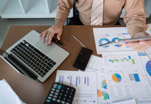 Analyzing financial data office setting business report contemporary workspace overhead view strategic insights for growth